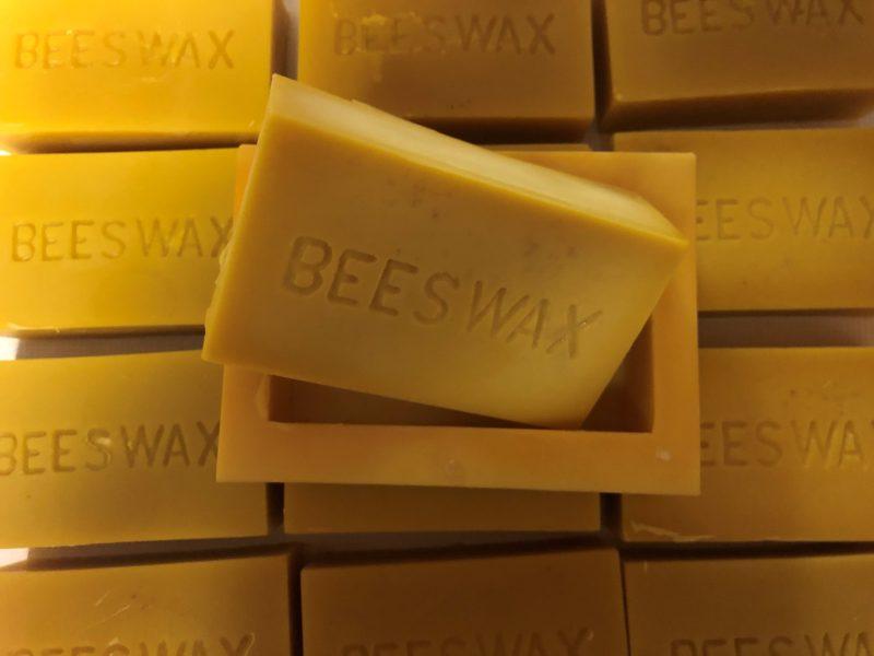 beeswax being removed from mold