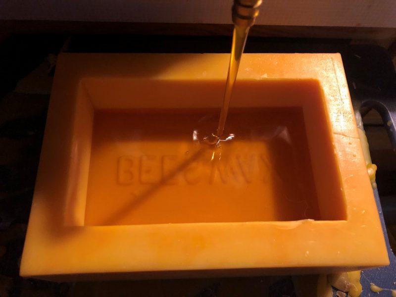 beeswax mold being filled